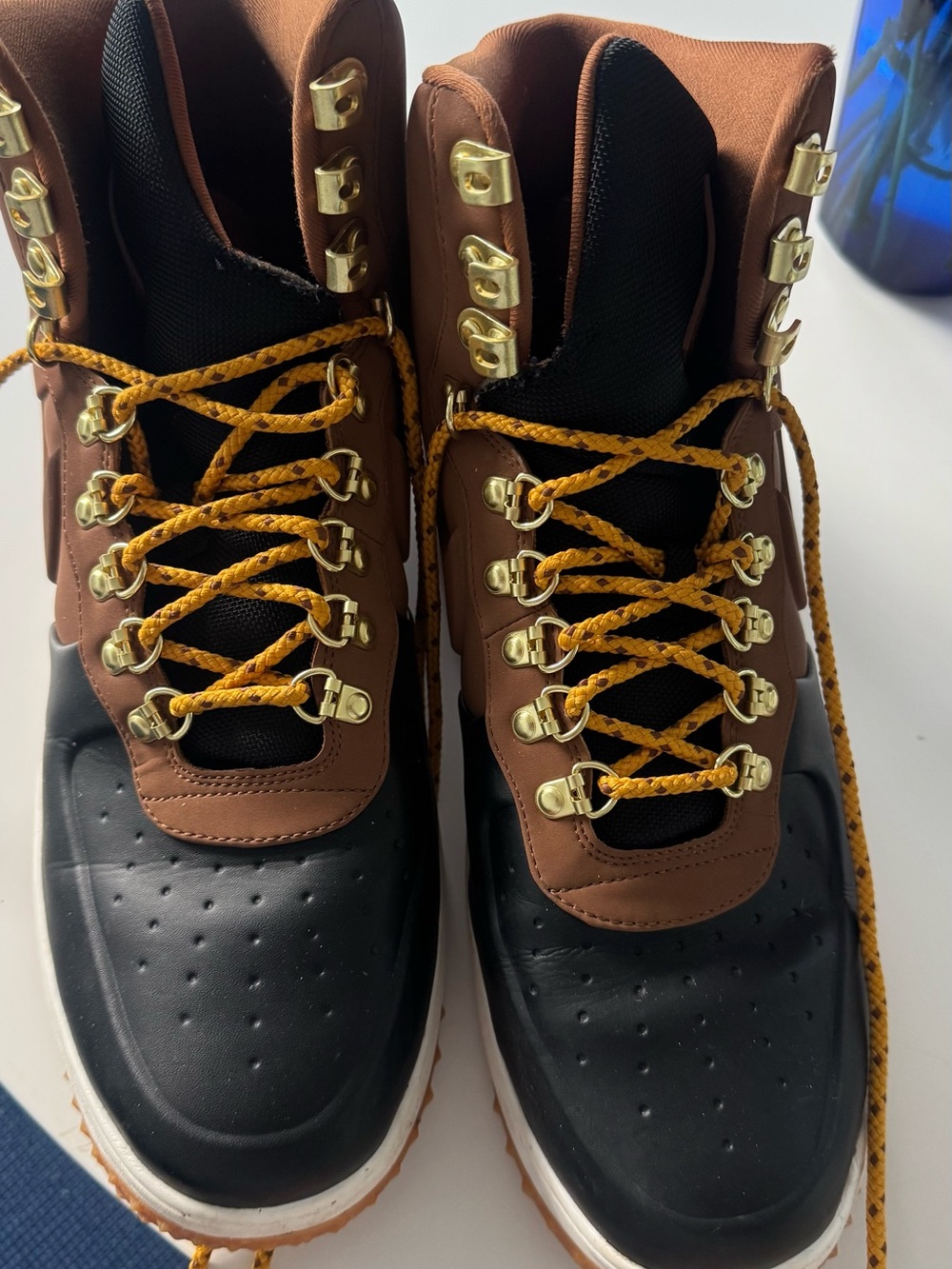 Nike Brown and Black High-Top Sneakers with Gold Hardware